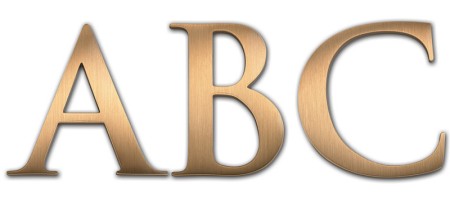 Image of Gemini cast metal letter in TRAJAN BOLD font style.